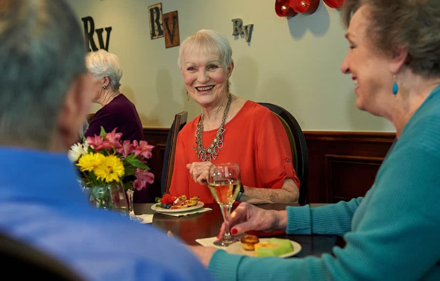 Senior Living residents of Redstone Village enjoying social hour