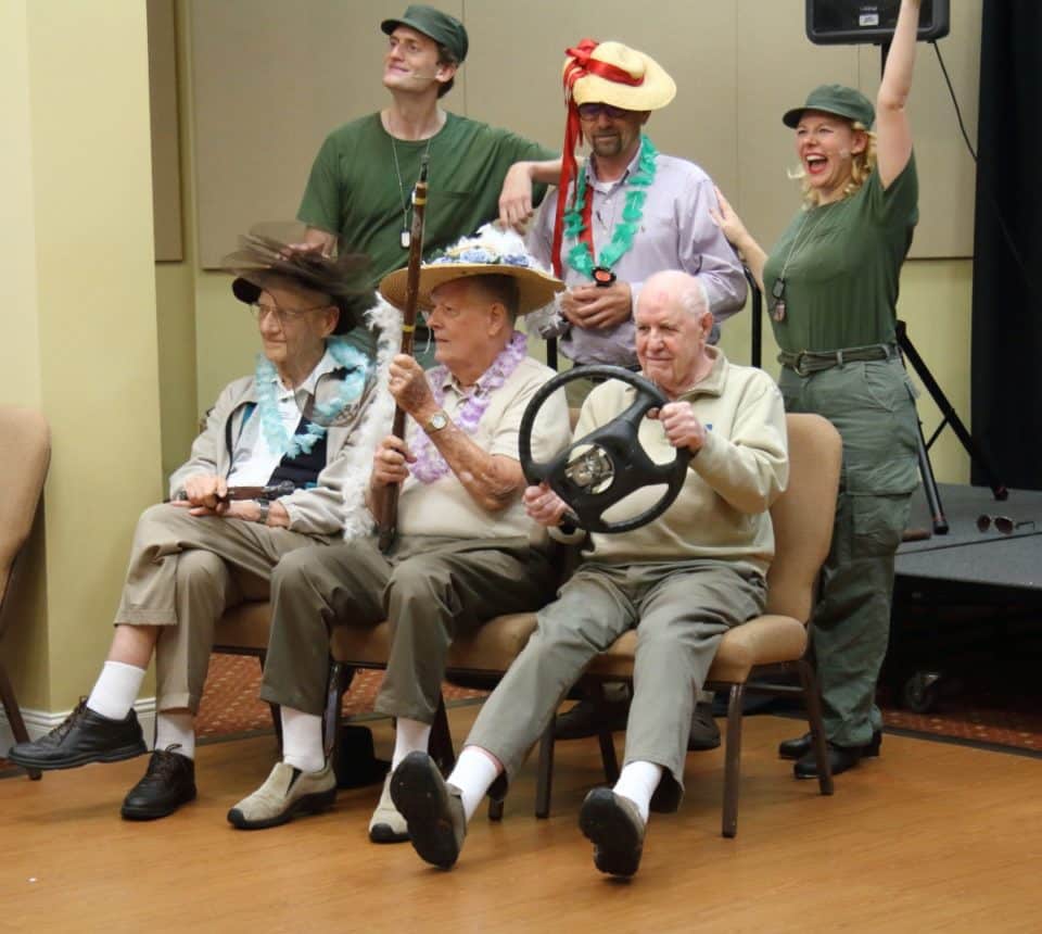 Group of residents participating in a skit during a military-themed special event