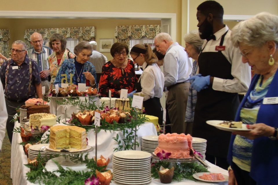 Group of Redstone Village residents enjoying desserts at 15th anniversary celebration